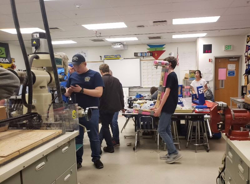 Spartronics students assembling the robot