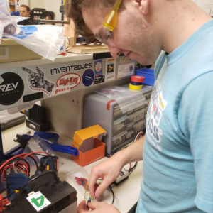 Spartronics student working on electronics